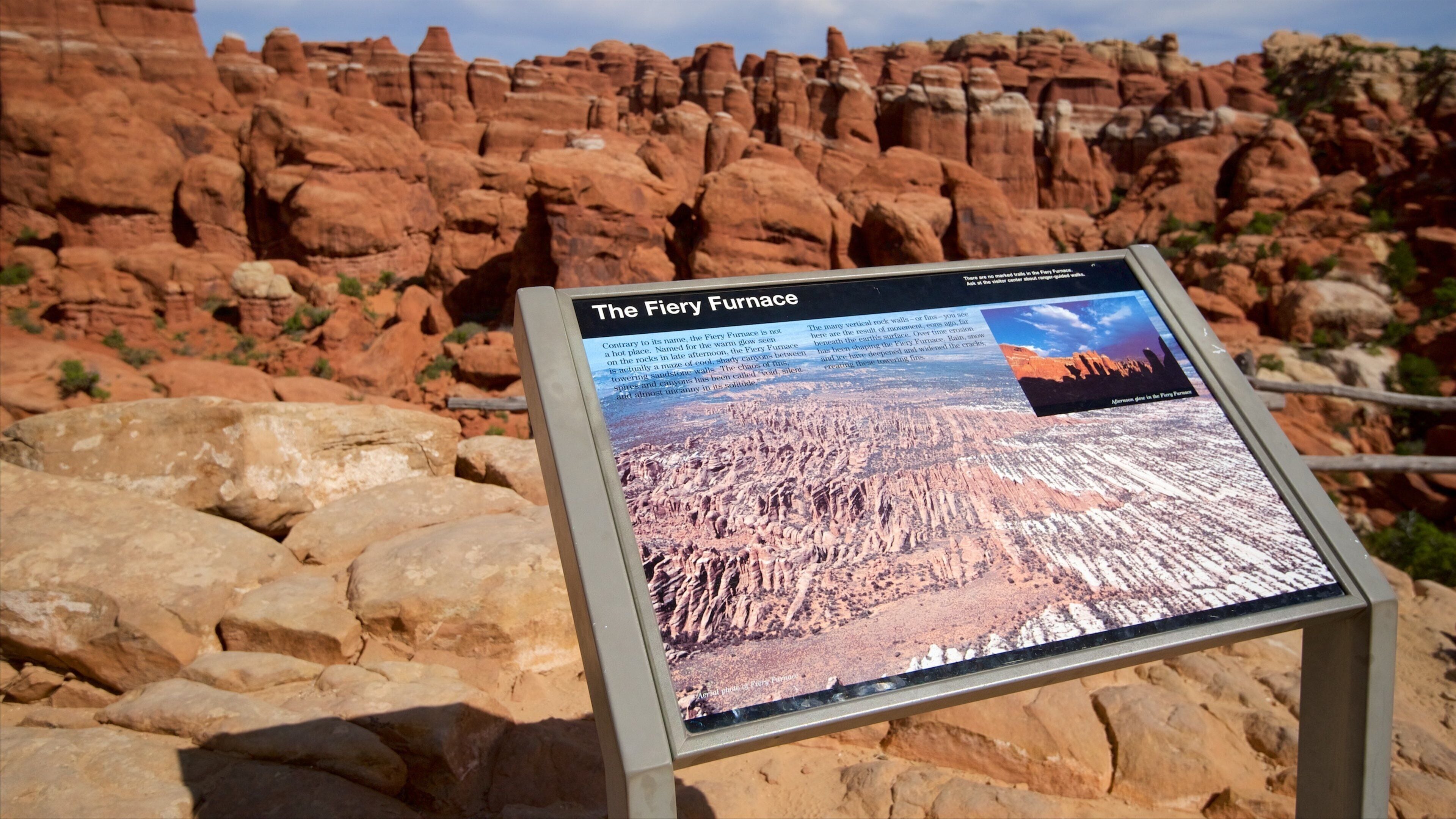 Arches National Park featuring desert views, a gorge or canyon and signage