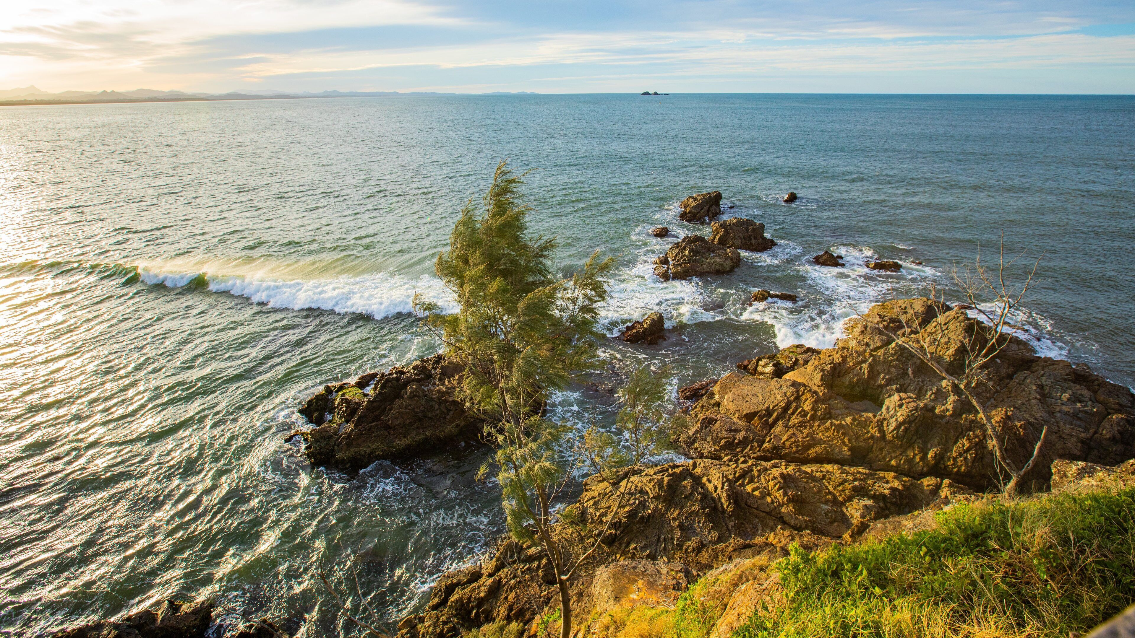 St Maarten and St Martin featuring general coastal views, rugged coastline and a sunset