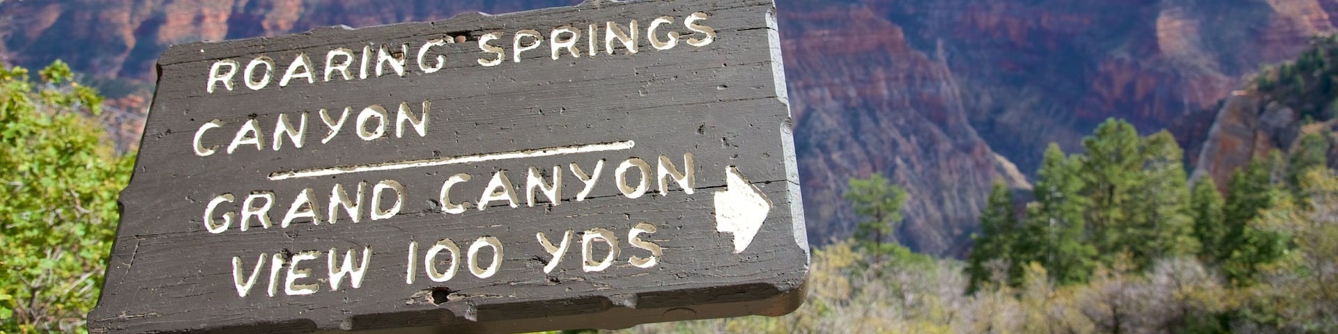 Roaring Springs Canyon which includes a gorge or canyon, signage and landscape views