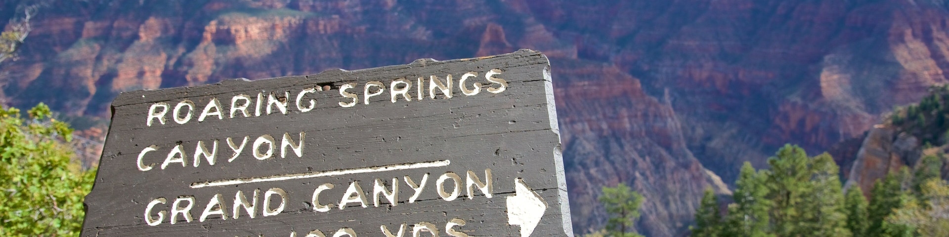 Roaring Springs Canyon which includes a gorge or canyon, signage and landscape views