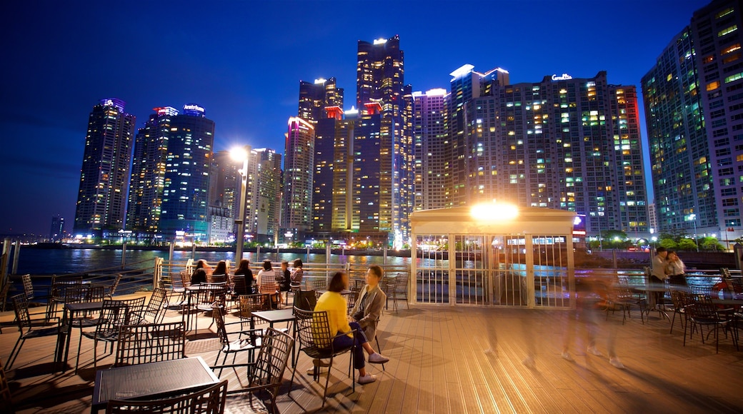 Busan showing a skyscraper, a city and outdoor eating