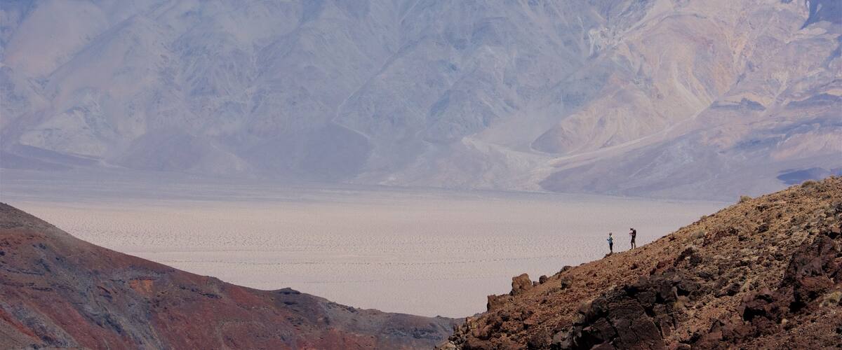 Death Valley featuring desert views and mountains as well as a couple