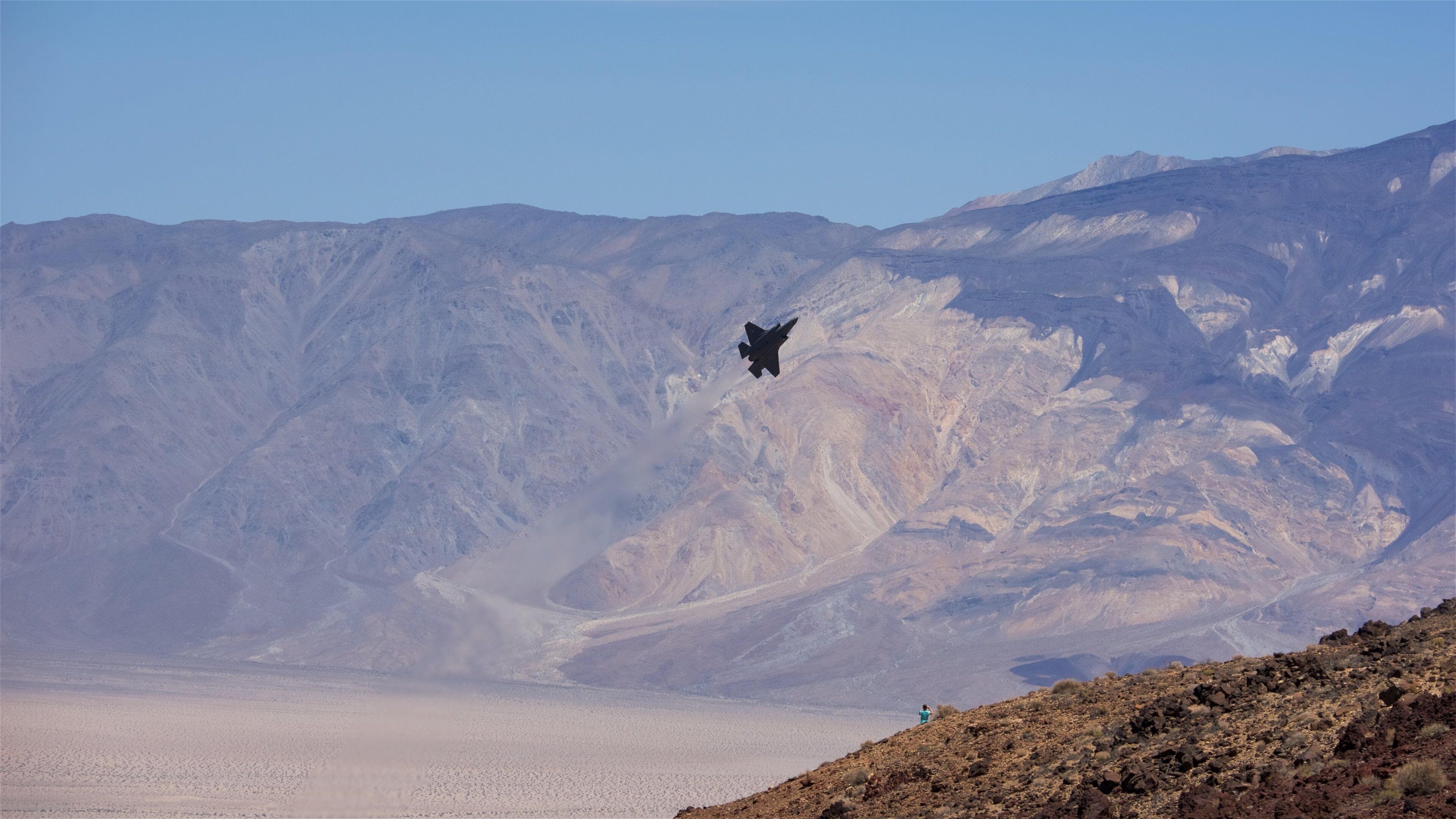 Death Valley which includes desert views, an aircraft and mountains