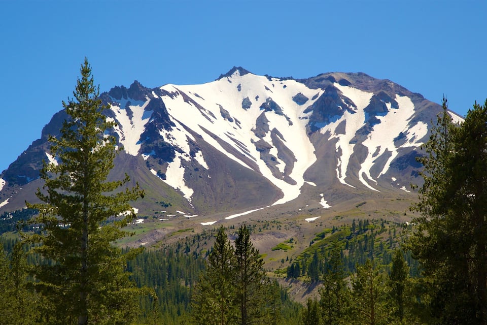 A snow-capped mountain with a clear blue sky.
