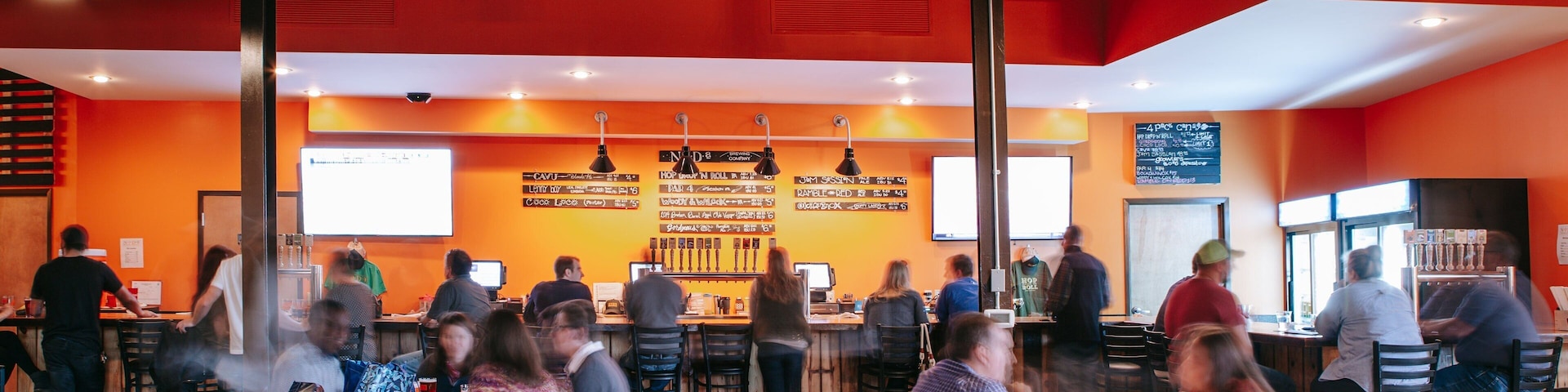 NoDa Brewing Company showing interior views as well as a small group of people