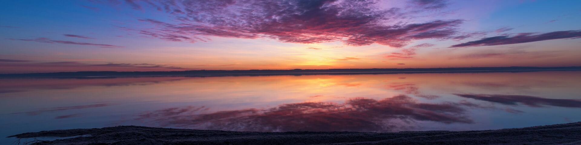 Next to the boat landing is a beach of shells