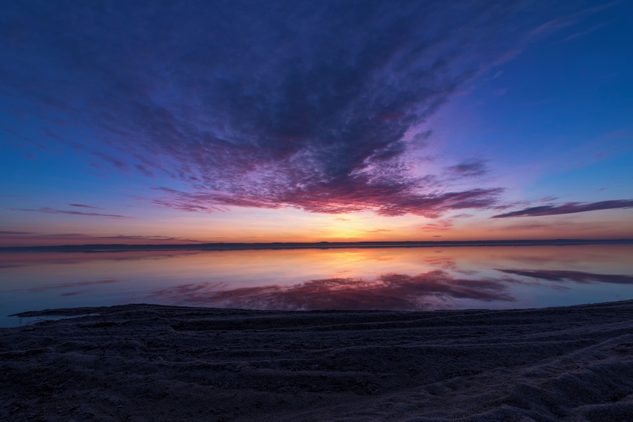 Next to the boat landing is a beach of shells