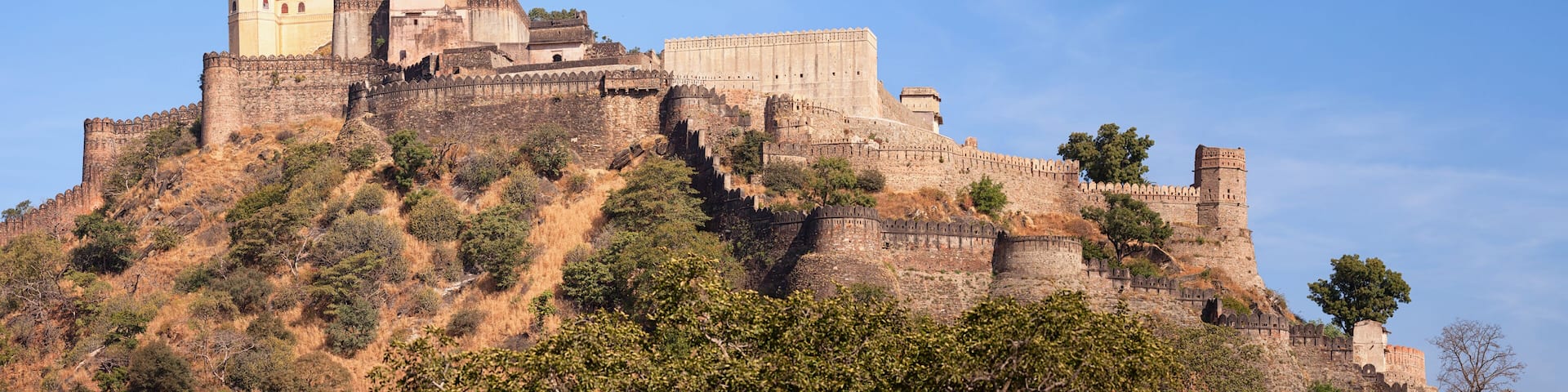 A historic fort perched on a hill with multiple towers and walls.