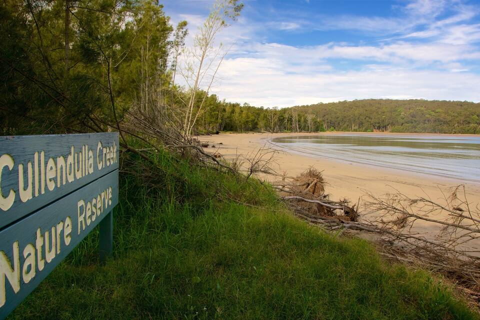 A beach with a sign reading "Cullenda Creek Nature Reserve".