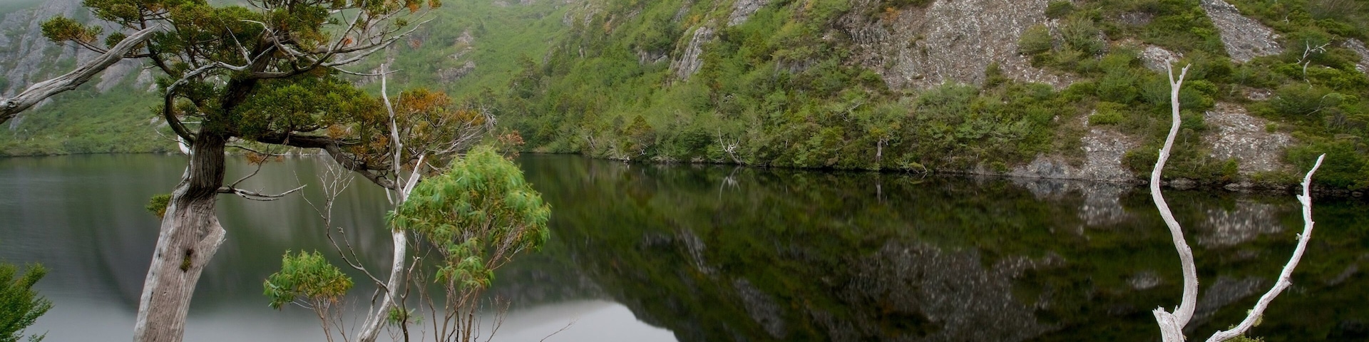 Crater Lake showing a river or creek and mist or fog