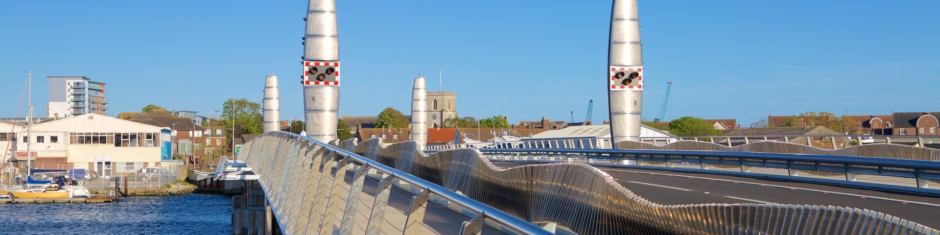 Poole Twin Sails Bridge featuring a bay or harbor and a bridge