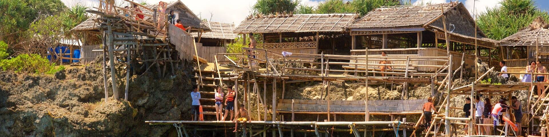 Magic Island showing a lake or waterhole and a small town or village