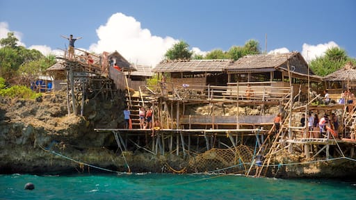 Magic Island showing a lake or waterhole and a small town or village