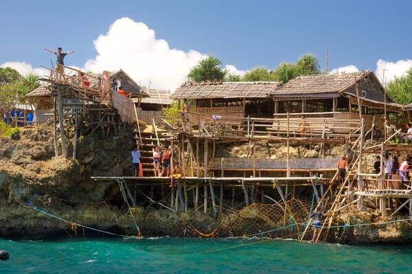 Magic Island showing a lake or waterhole and a small town or village