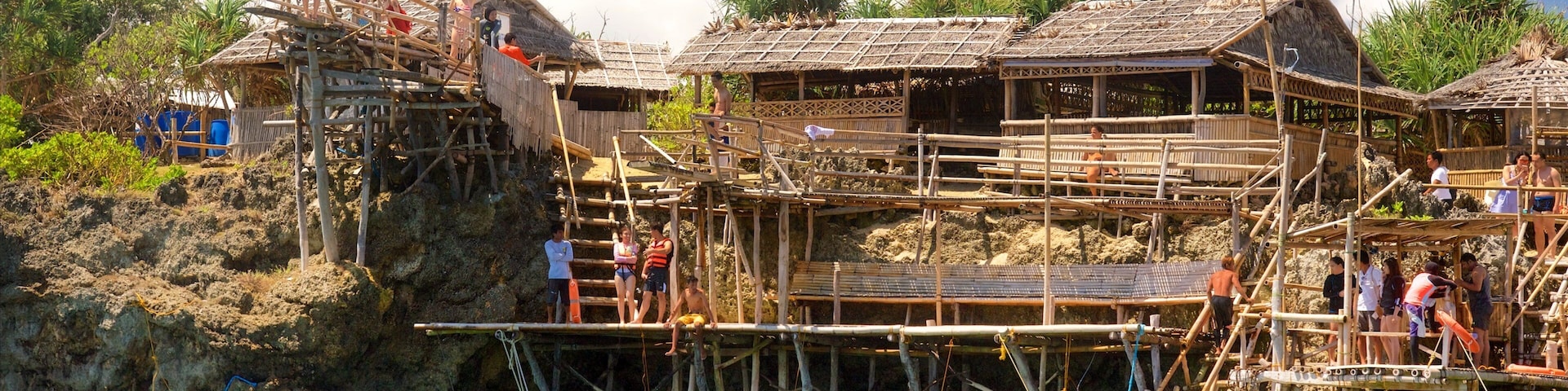 Magic Island showing a lake or waterhole and a small town or village