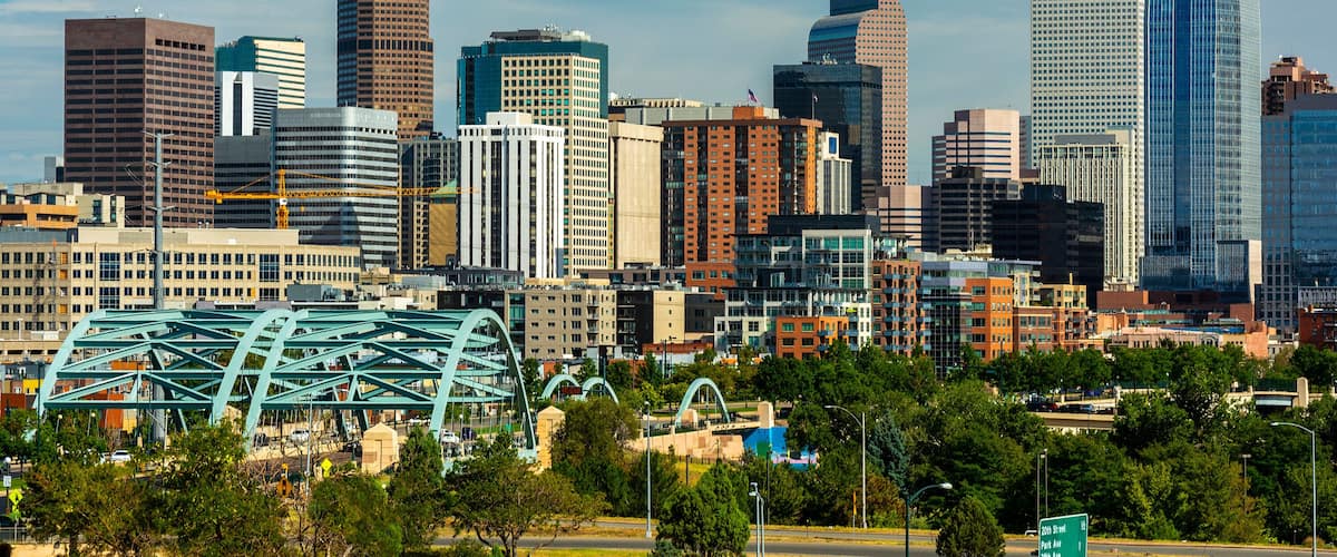 Downtown Denver, Colorado Skyscrapers with Confluence Park and the Speer Blvd. Platte River Bridges in the Foreground