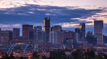 The skyline of Denver, CO at sunrise on a summer morning.