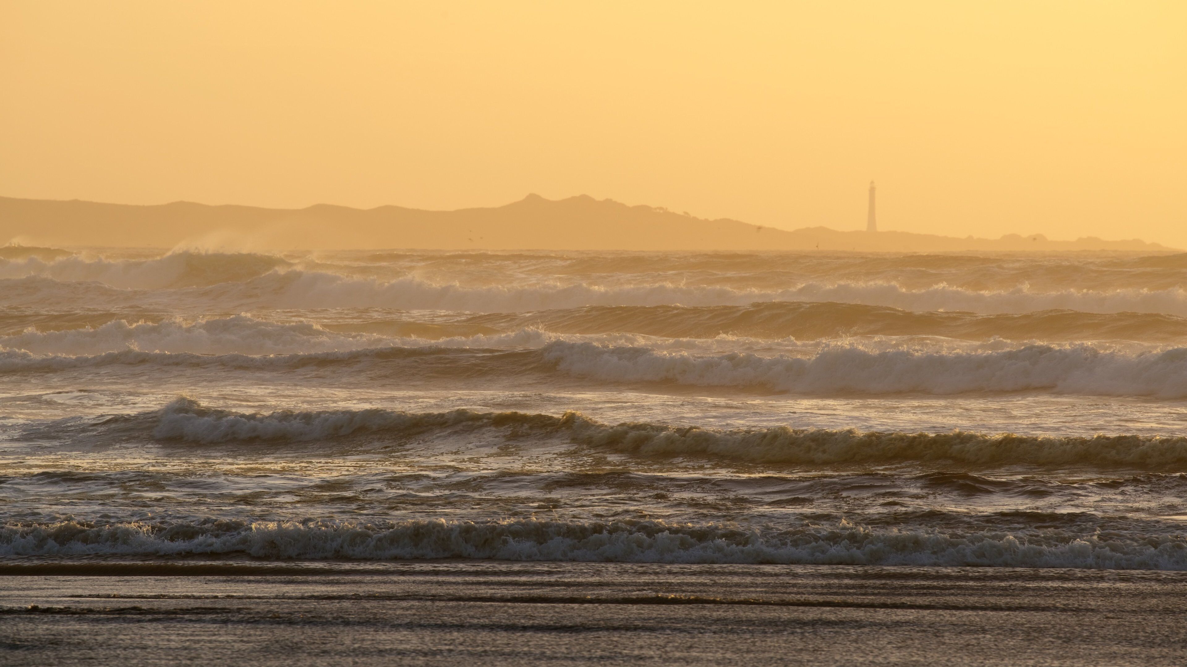 Ocean Beach showing a sunset, general coastal views and surf