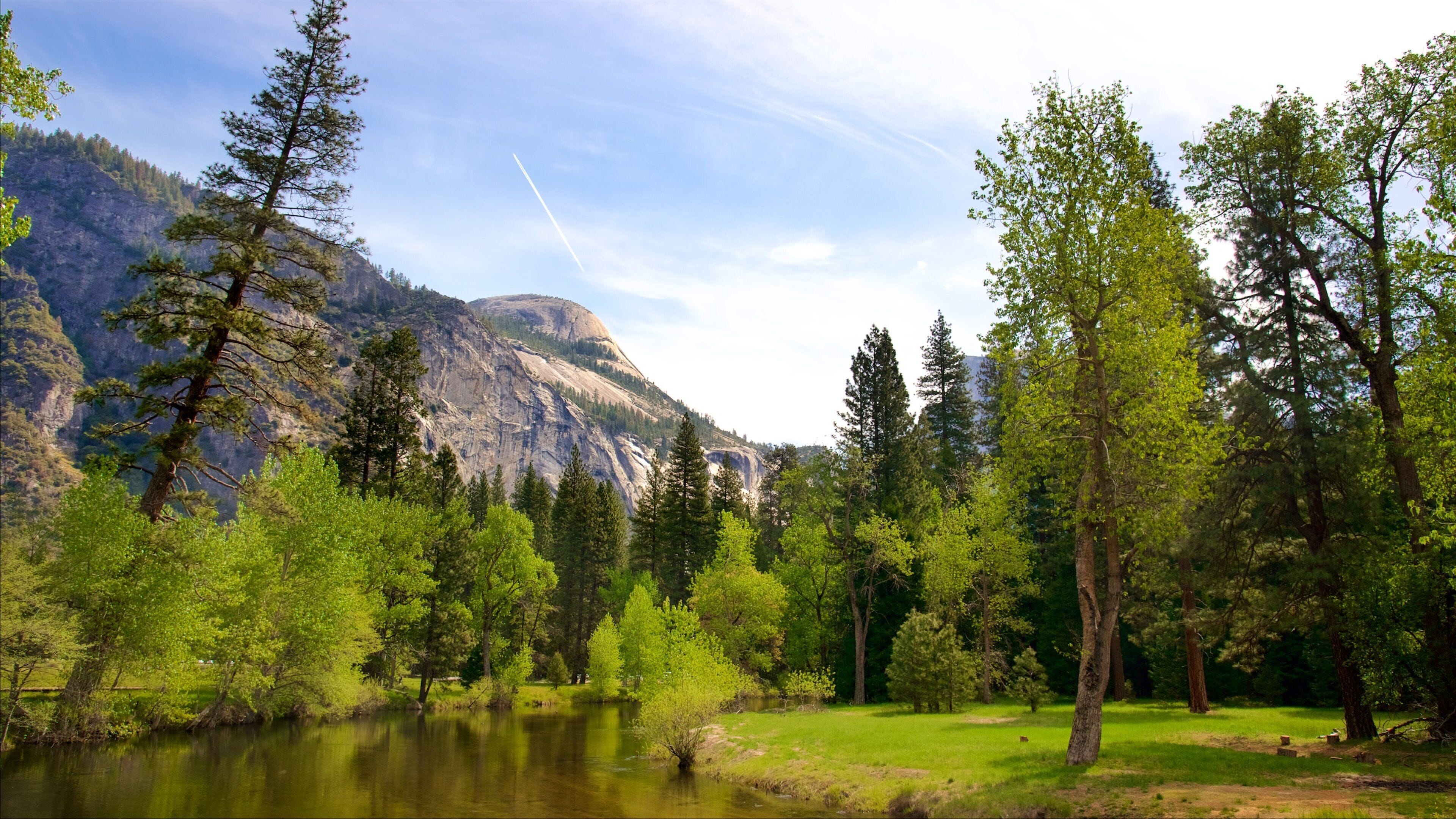 Yosemite National Park which includes mountains, a river or creek and tranquil scenes