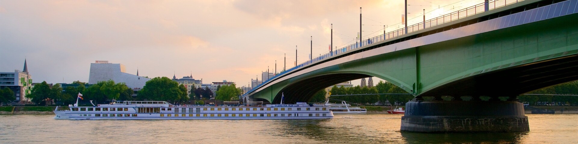 Kennedy Bridge which includes a bridge, a river or creek and a sunset