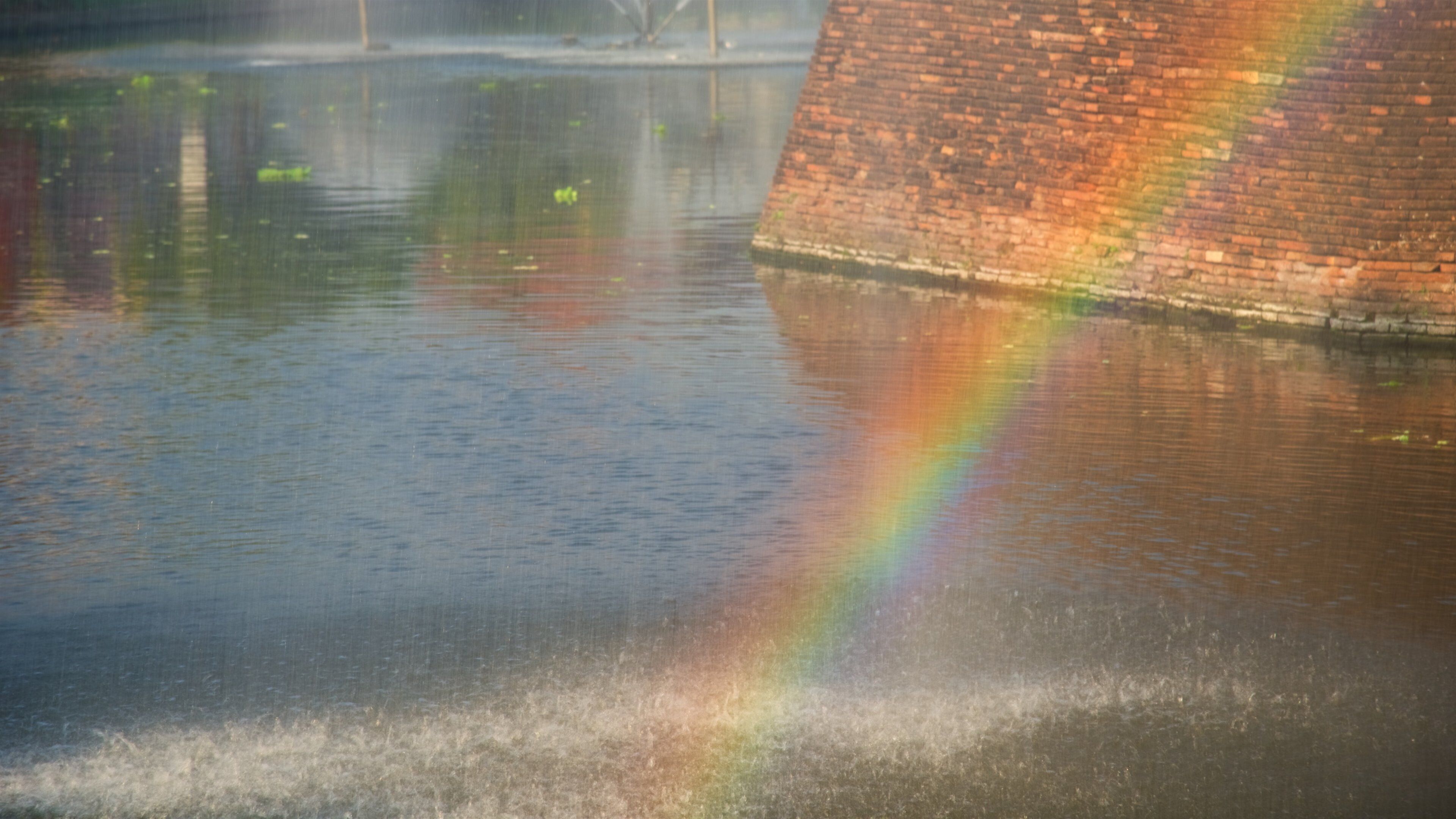 Katam Corner which includes a fountain and a river or creek