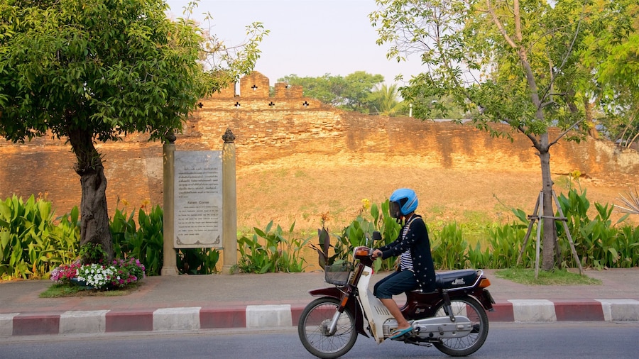 Katam Corner showing motorcycle riding as well as an individual femail