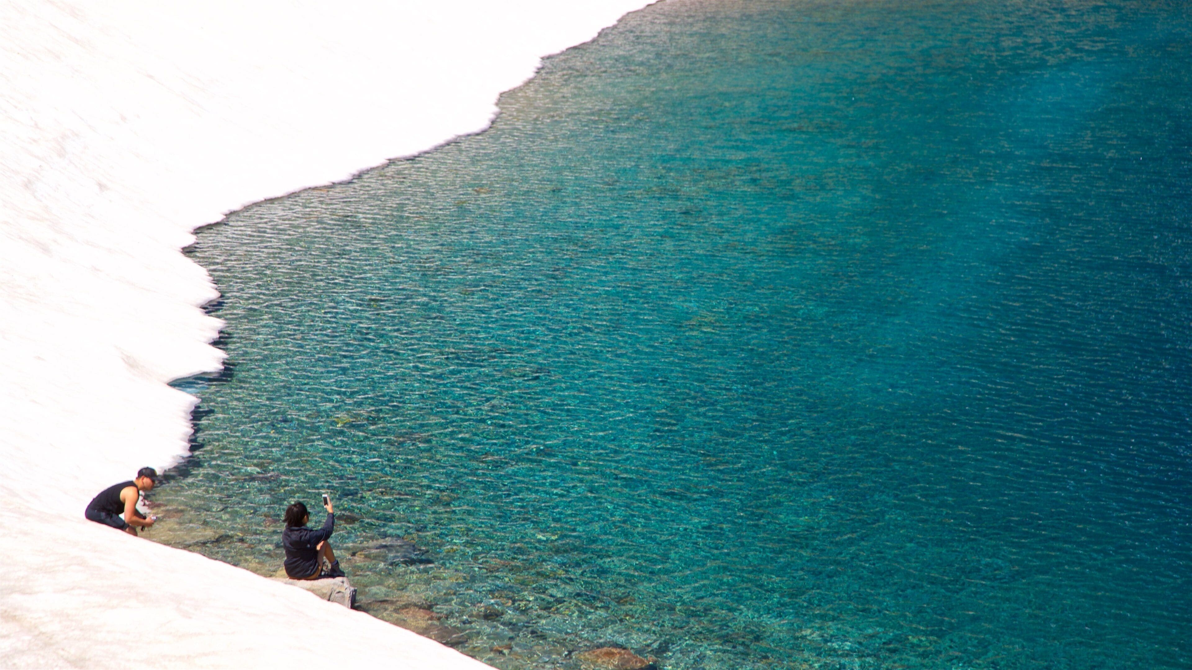 Lake Helen showing a lake or waterhole as well as a couple