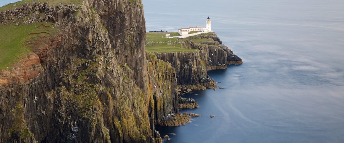 Isle of Skye showing rocky coastline and a lighthouse