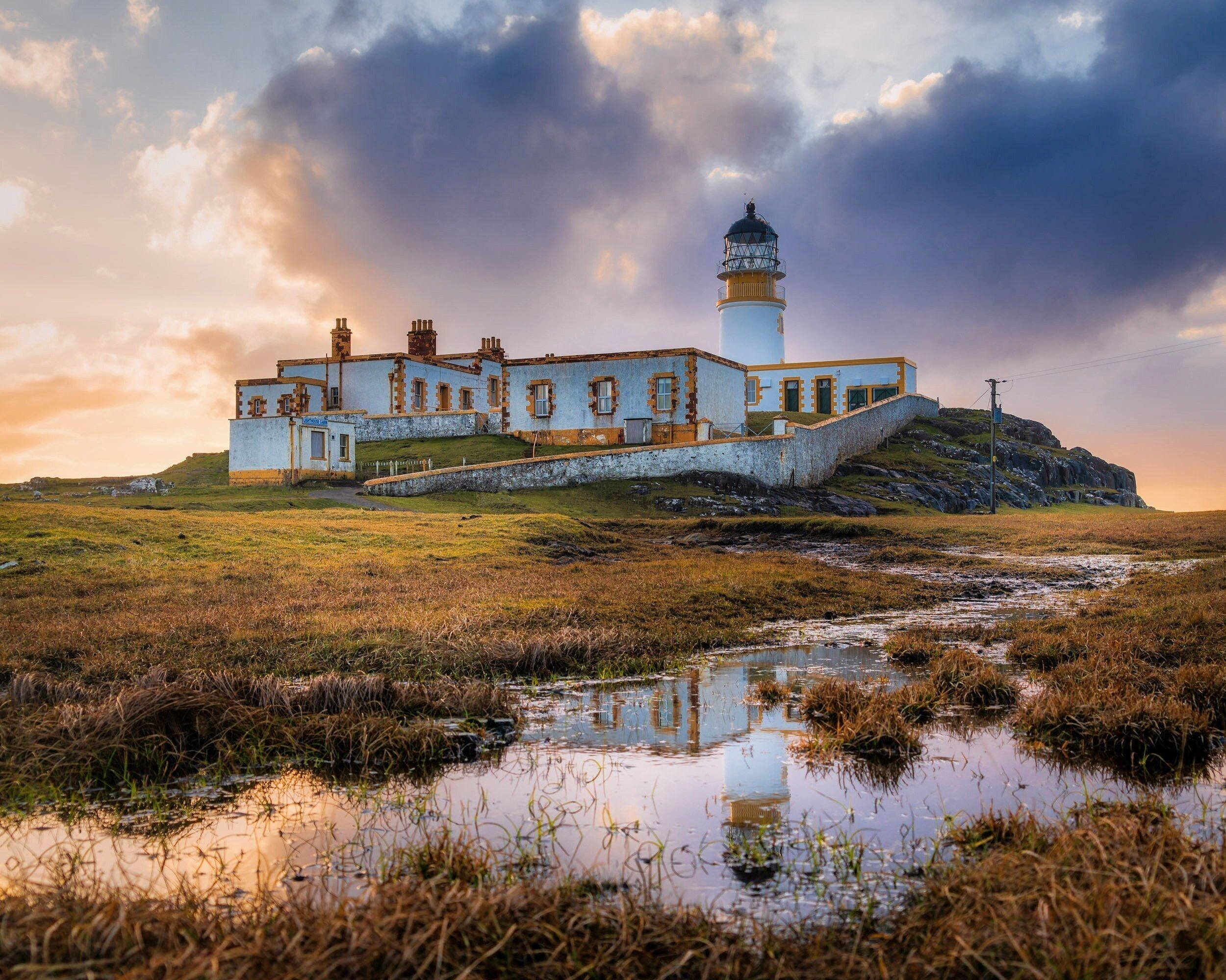 The weather was bit misleading here on the Isle of Skye in Scotland. When I left my house at Skeabost Bridge, it was raining, and the sky was grey, but the sign of light coming from the Neist Point direction did bring some hope to this photography journey. I was very windy around the Neist Point lighthouse, but beautiful at the same time.