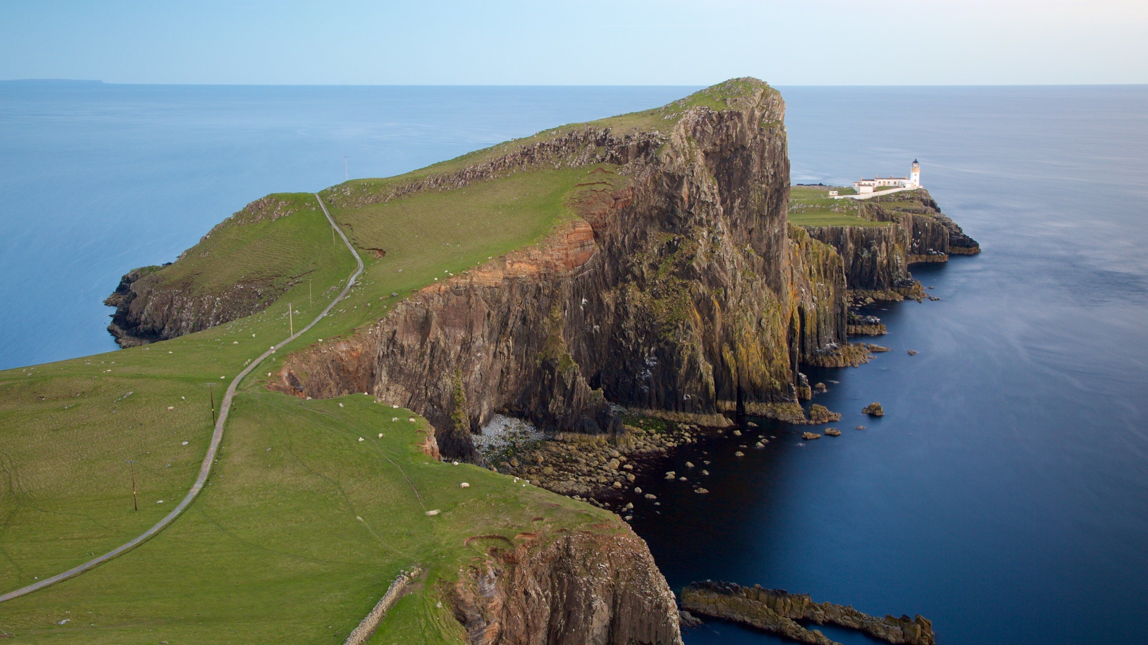 Isle of Skye showing a lighthouse and rocky coastline