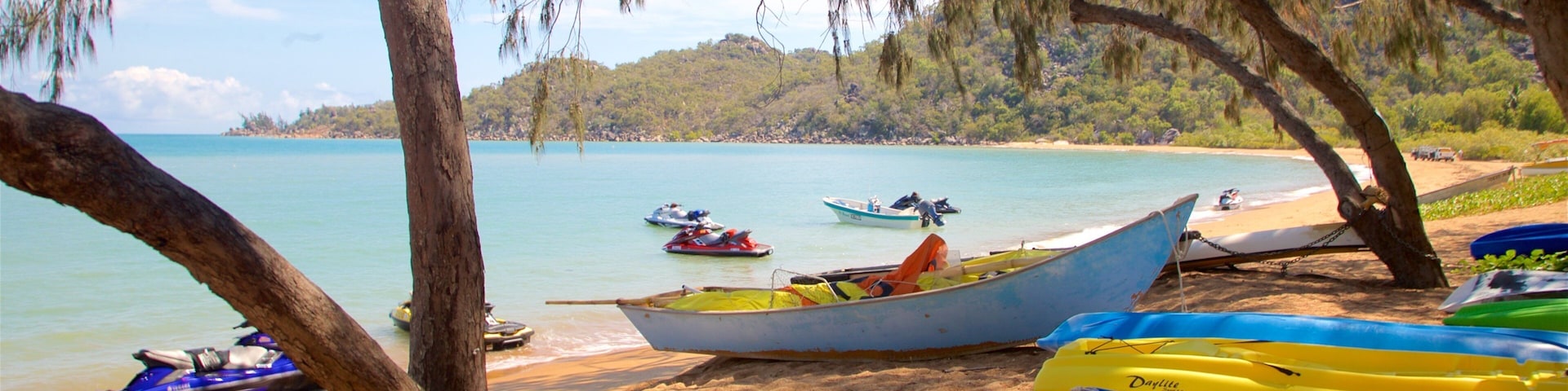 Magnetic Island showing a sandy beach, general coastal views and jet skiing