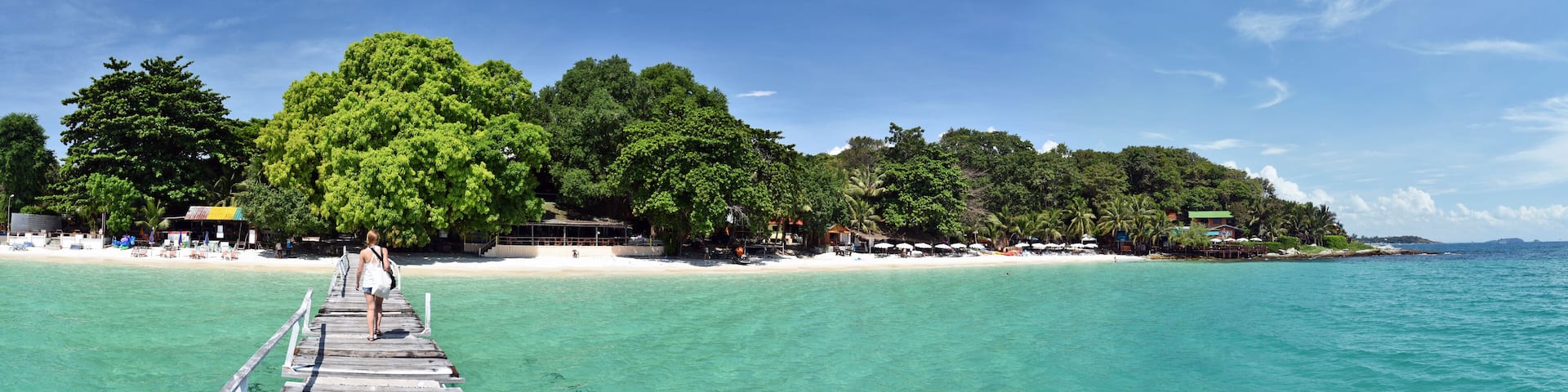Panorama of the tropical beach resort from wooden jetty
