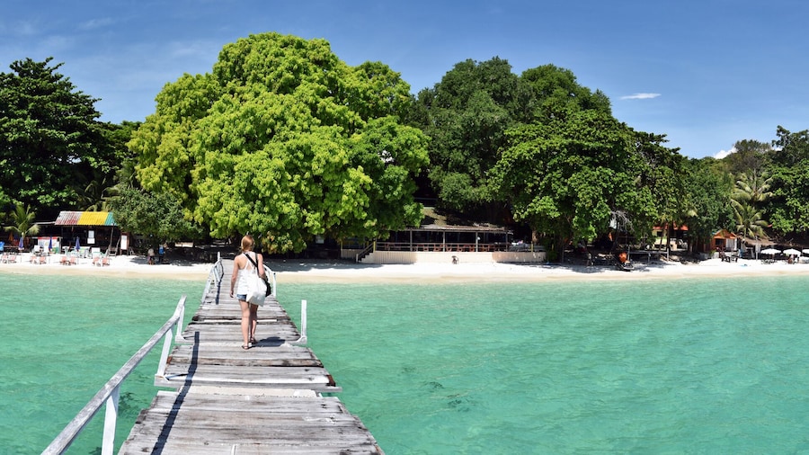 Panorama of the tropical beach resort from wooden jetty
