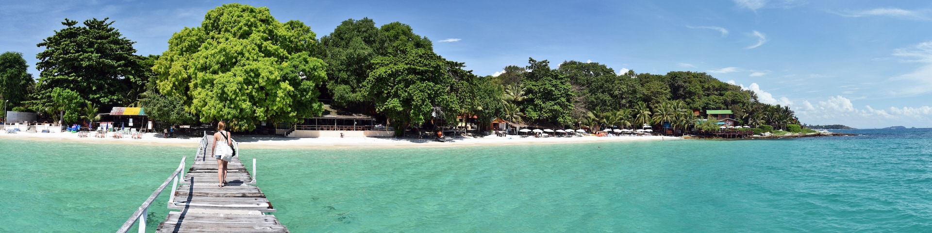 Panorama of the tropical beach resort from wooden jetty