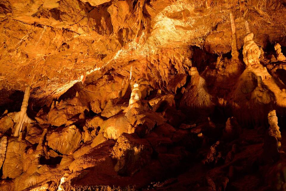 A cave with stalactites and stalagmites.
