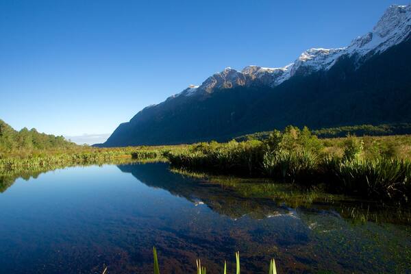 Mirror Lake showing a sunset, landscape views and a lake or waterhole