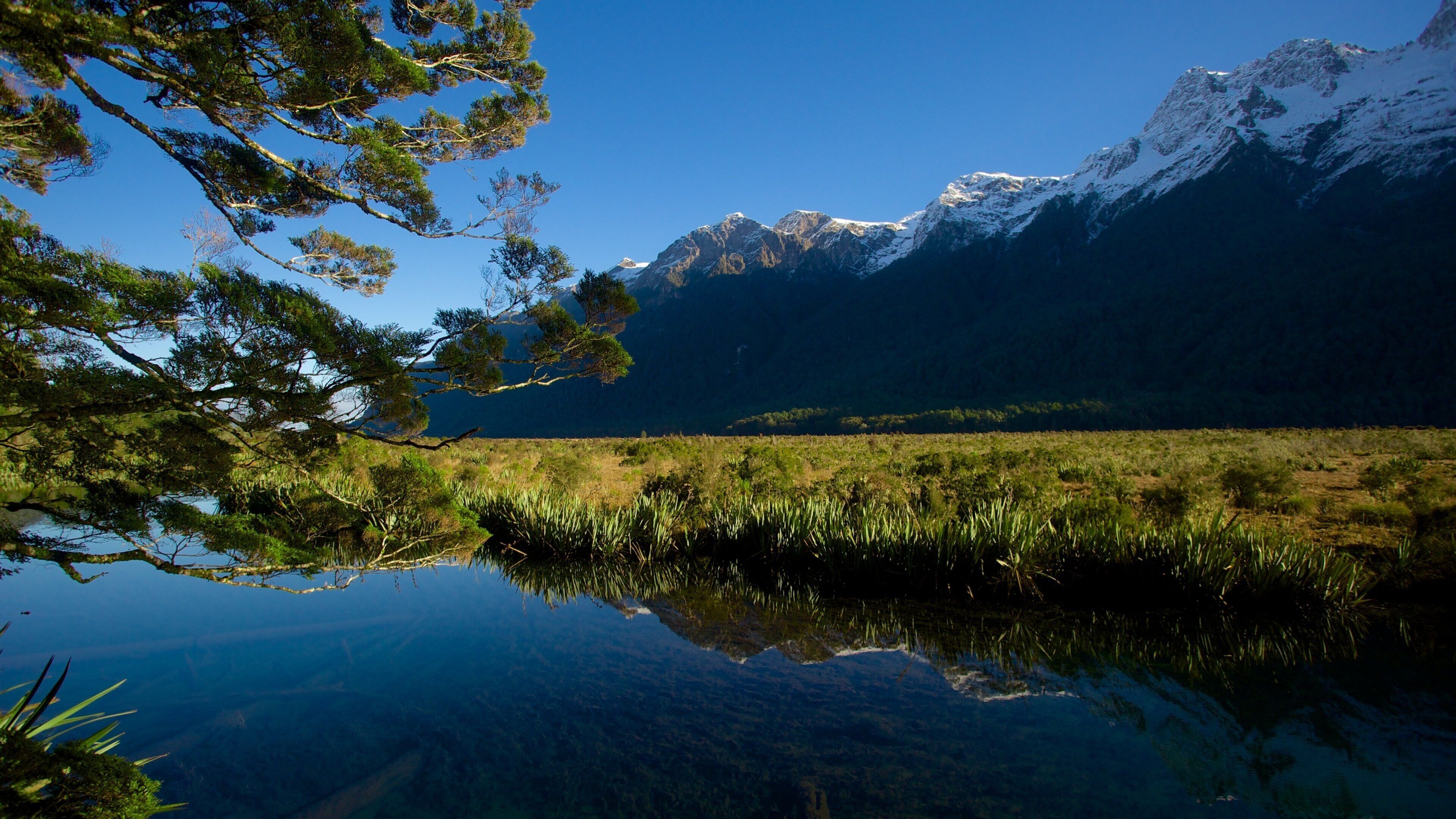 Mirror Lake showing a lake or waterhole, landscape views and a sunset