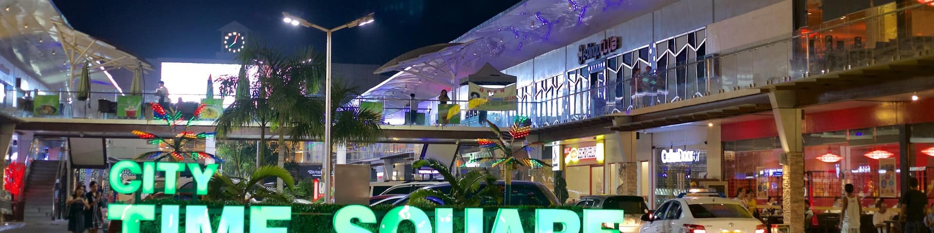 Cebu which includes night scenes and signage