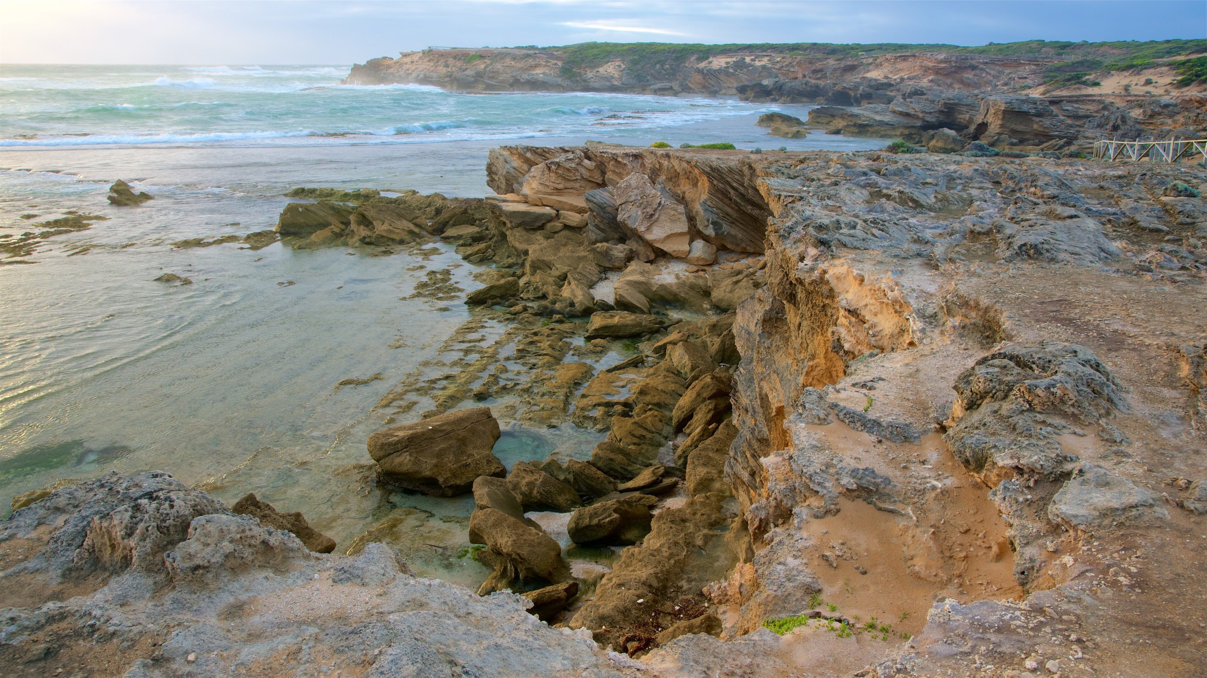 Warrnambool which includes a bay or harbor and rugged coastline