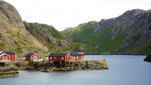 Leknes showing a lake or waterhole, a small town or village and mountains