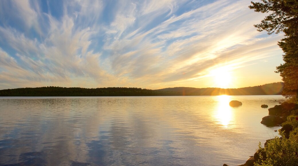 Inari which includes a lake or waterhole, a sunset and landscape views