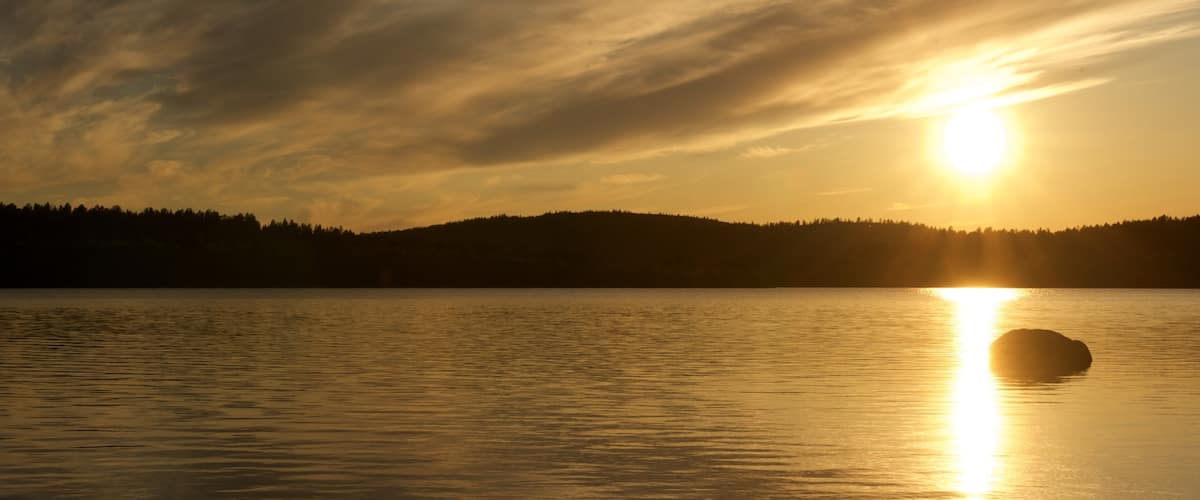 Lake Menesjärvi featuring a lake or waterhole, landscape views and a sunset
