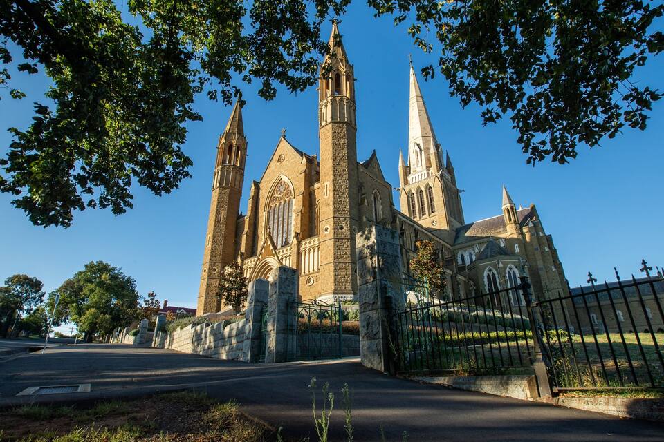 A large Gothic-style church with multiple spires and a prominent central tower.