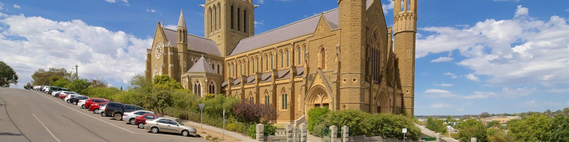 A large church with multiple spires and a clock tower.