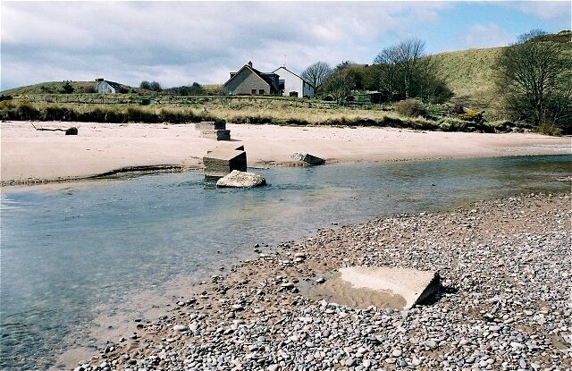 Lunan Water. WWII tank traps block the river below Red Castle, which is to the right.