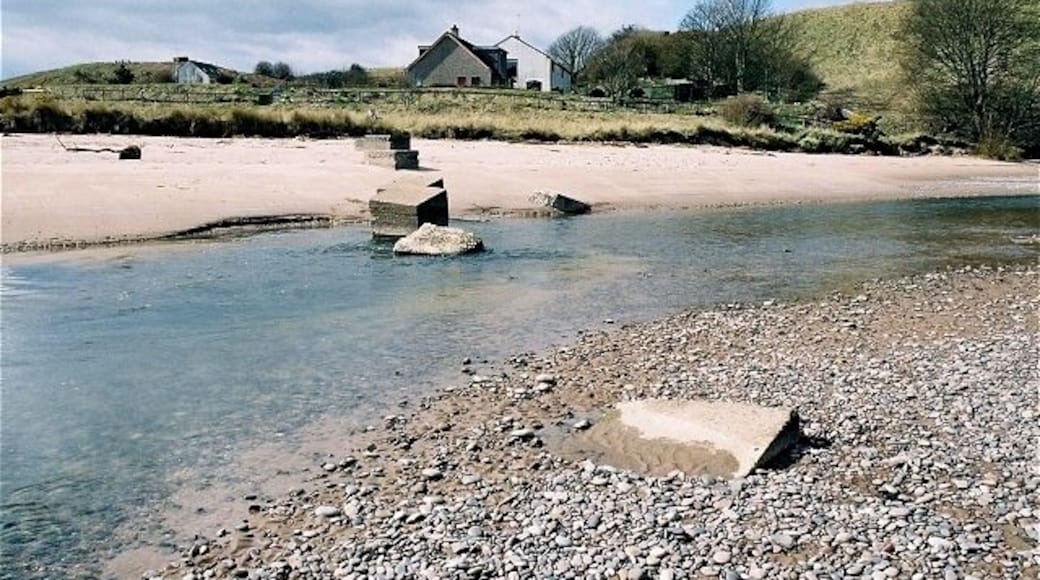 Lunan Water. WWII tank traps block the river below Red Castle, which is to the right.