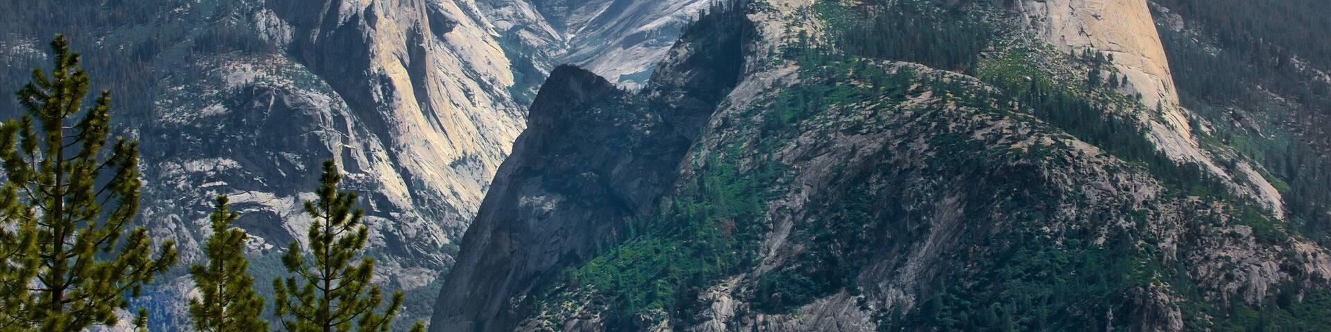 A mountain landscape with a prominent rock formation.