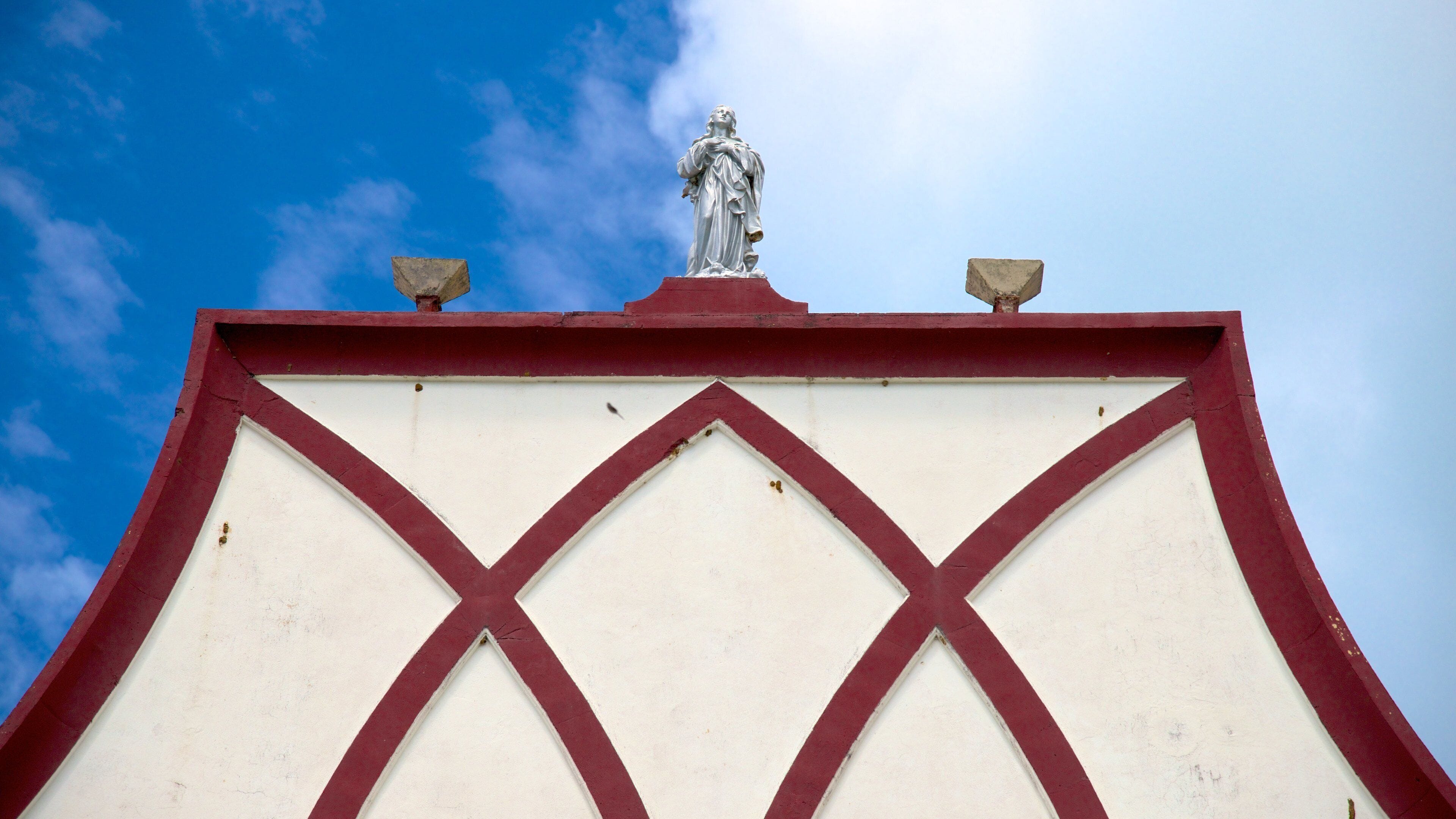 Isle of Pines featuring religious elements and a statue or sculpture
