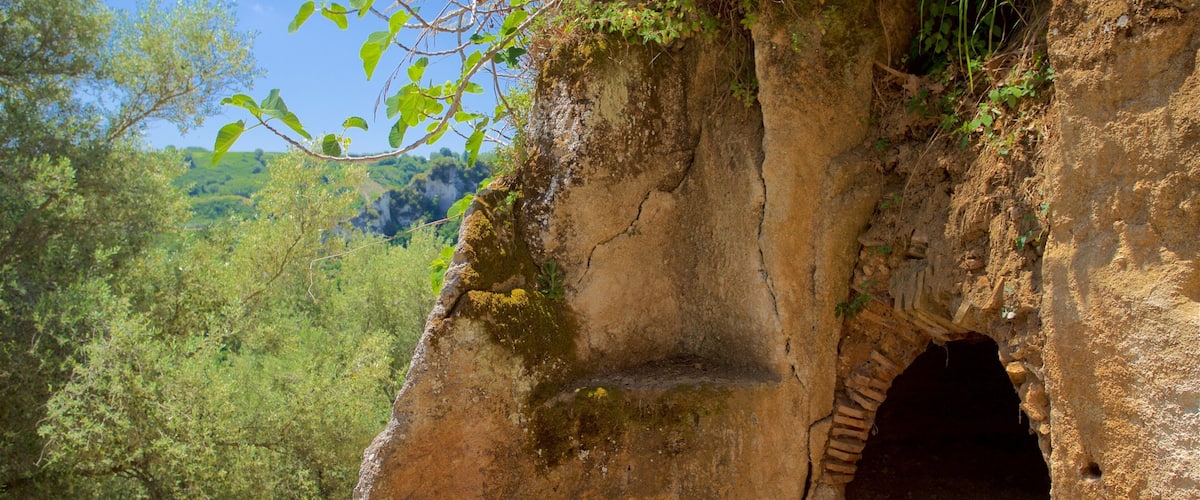 A natural rock formation with a cave entrance.