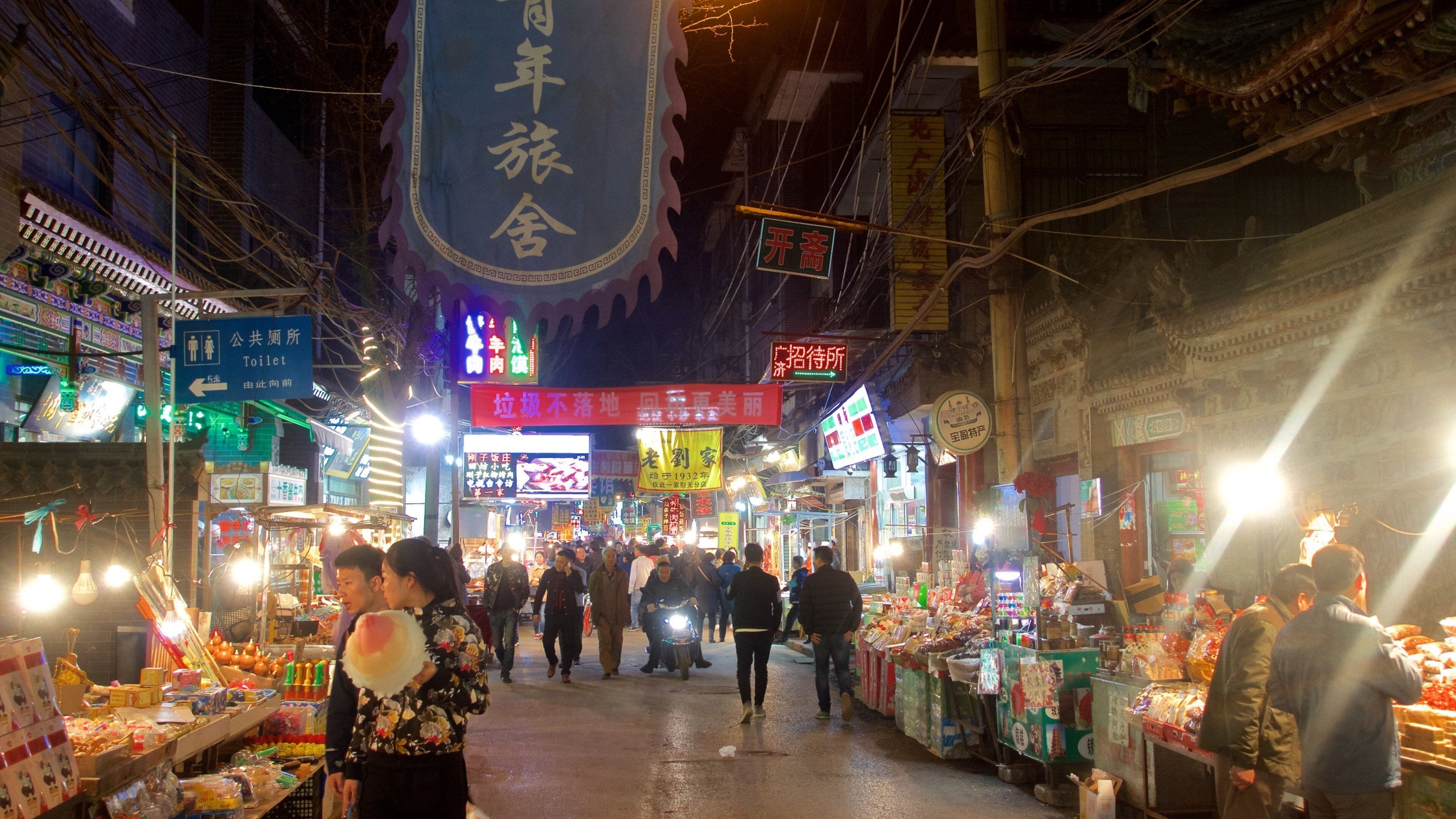 Xi\'an which includes markets and night scenes as well as a small group of people